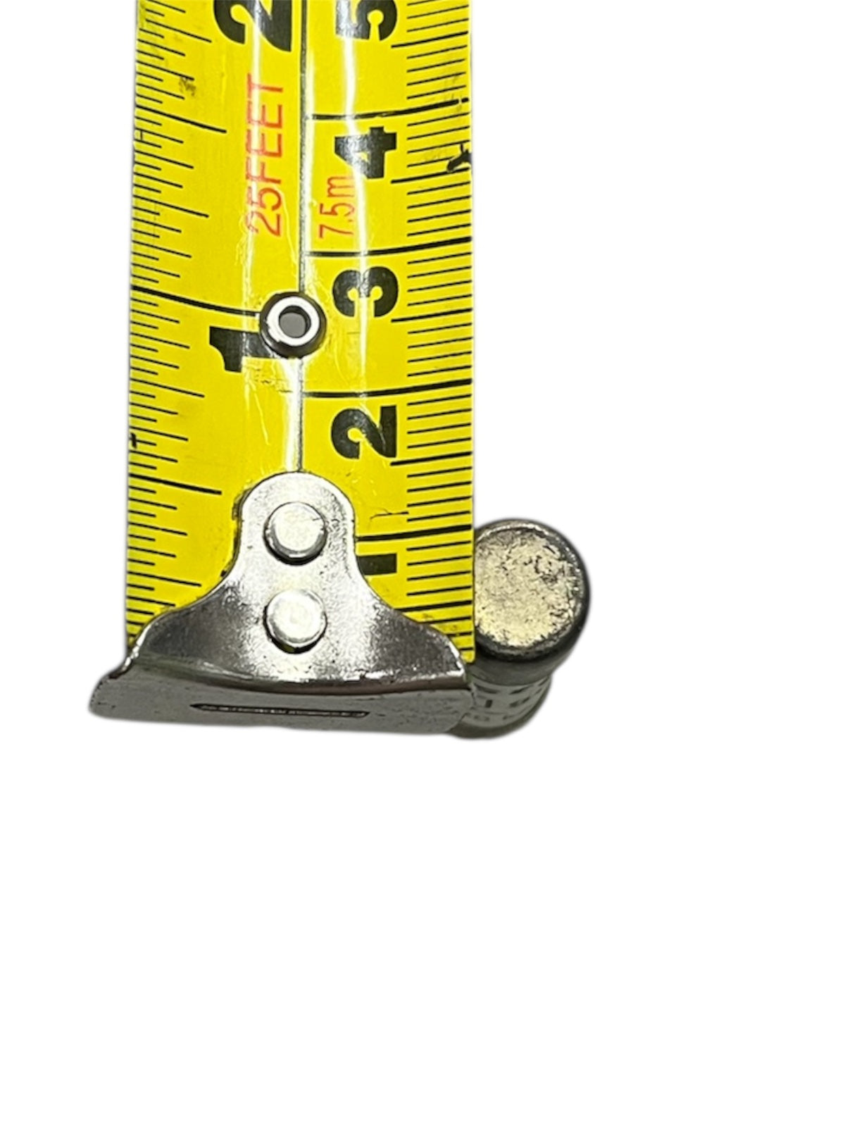 Close-up of a metal electrical fuse measured against yellow tape showing size Ceramic Fuse 25A 500V 10x38mm