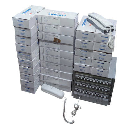 Stack of Commax branded boxes with phone equipment on a white  Commax 30 Station Intercom System CLS-10 Expandable With Handset T06 with Expand Unit CLS-10T(L) with Expand Unit CLS-10T(R) and 30pcs Sub-Station , 1pc CLS-10 + 1pc CLS-10T(L) + 1pc CLS-10T(R) + 30pcs TP-S + 1pc T06background