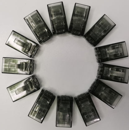 Circle of transparent black Denko RJ45 Connector colored adapters for powerline network connections