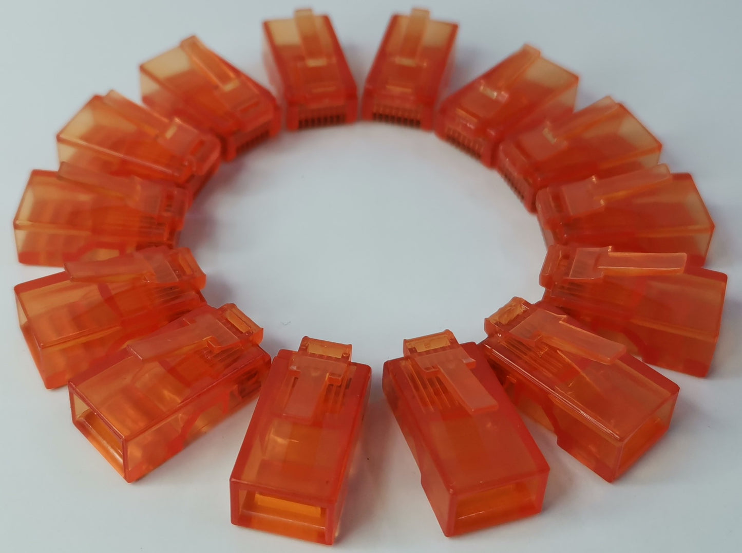 Grippes powerline network adapter with multiple Denko RJ45 Connector colored in translucent orange