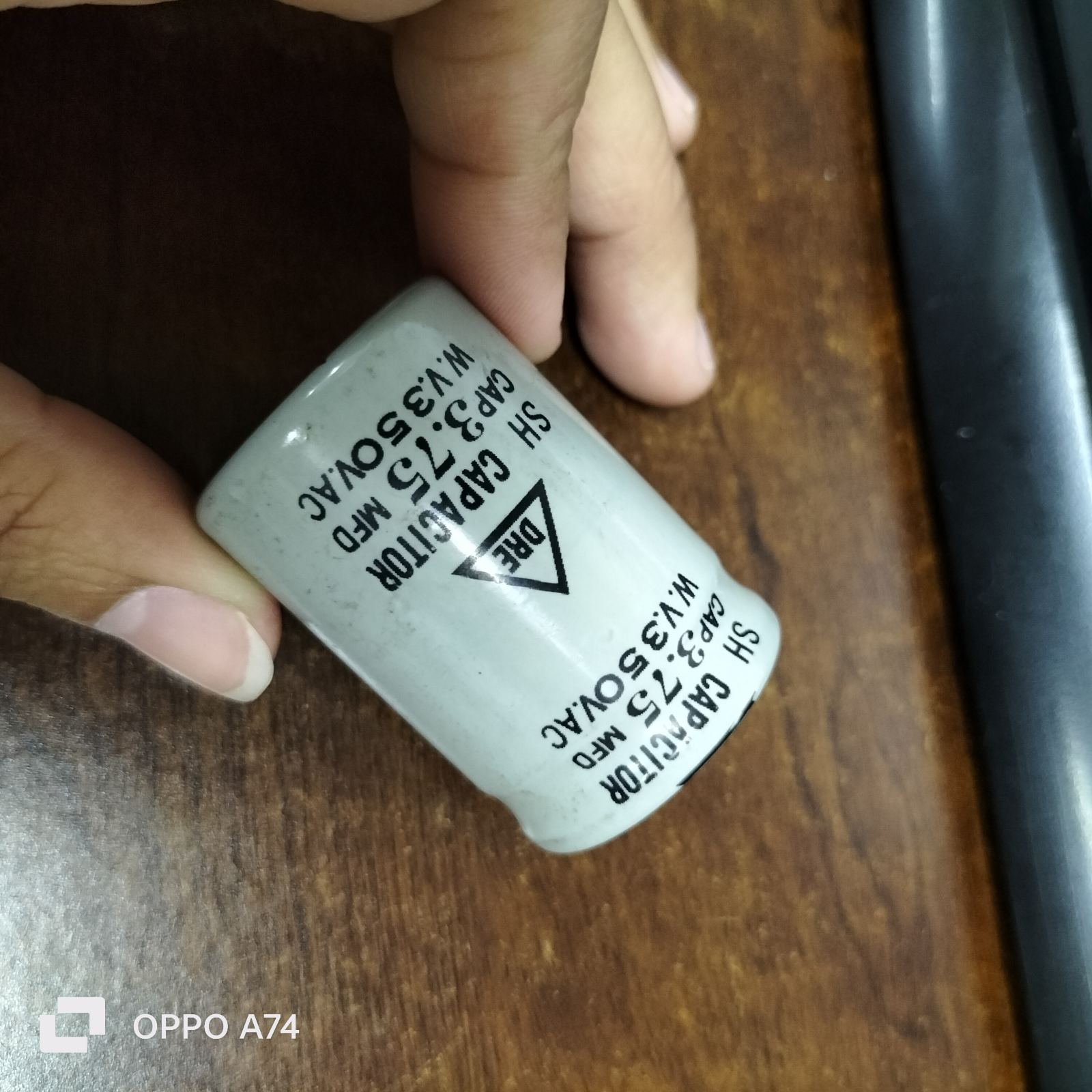 DRE 350V AC motor running capacitor with technical specifications visible on the label