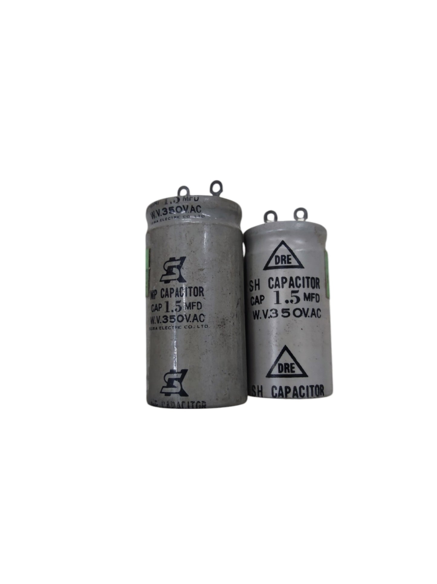 Two electrical capacitors labeled 1.5 MFD and 350V running capacitor 1MFD for circuit applications