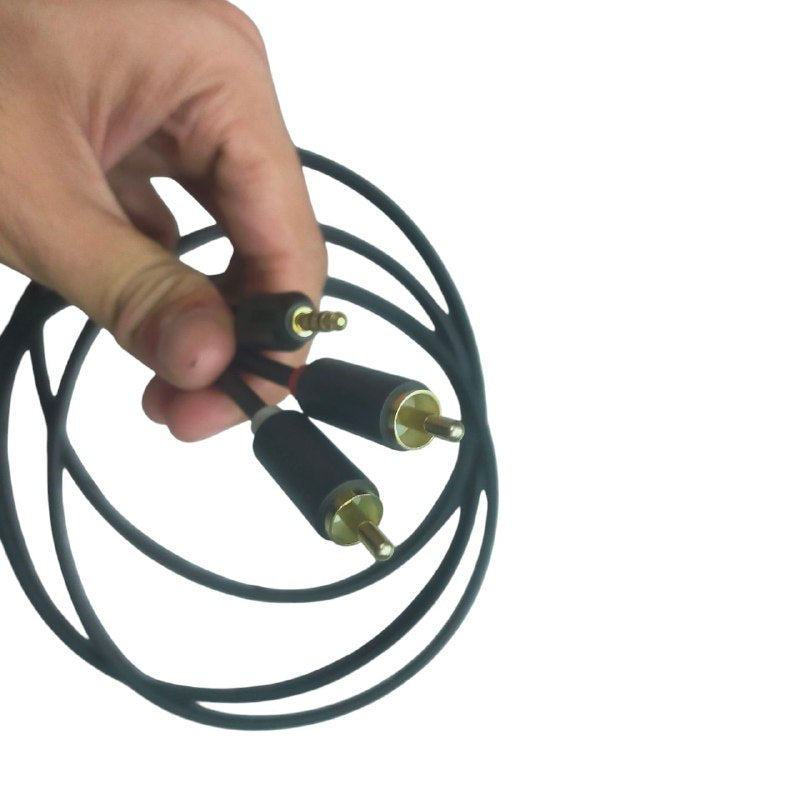 Hand holding a durable RCA to aux cable with gold connectors for high-quality audio connection