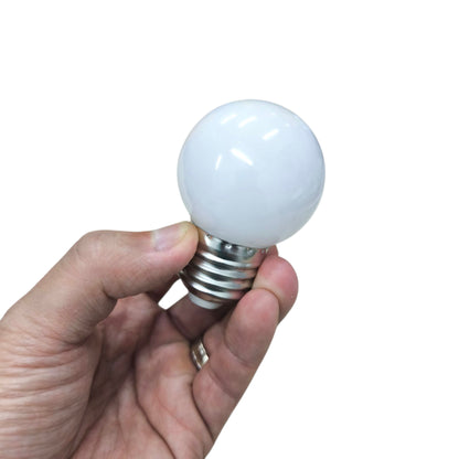 Denko E27 warm white LED bulb 3000K held in a hand, perfect for cozy lighting solutions