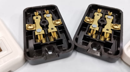 Eagle CAT2082 outlet adapter internal view showing brass connectors and screws in black casing