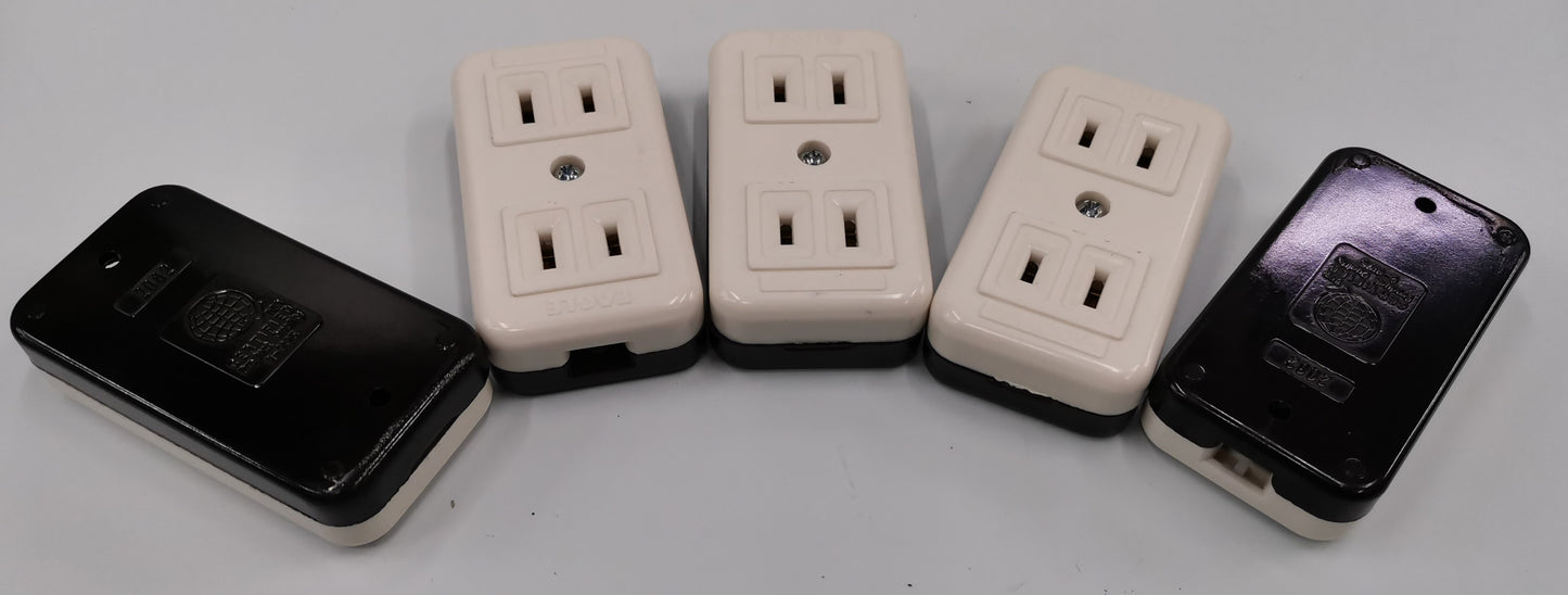 Eagle CAT2082 outlet adapter showing multiple white and black electrical outlet adapters for power points and plugs
