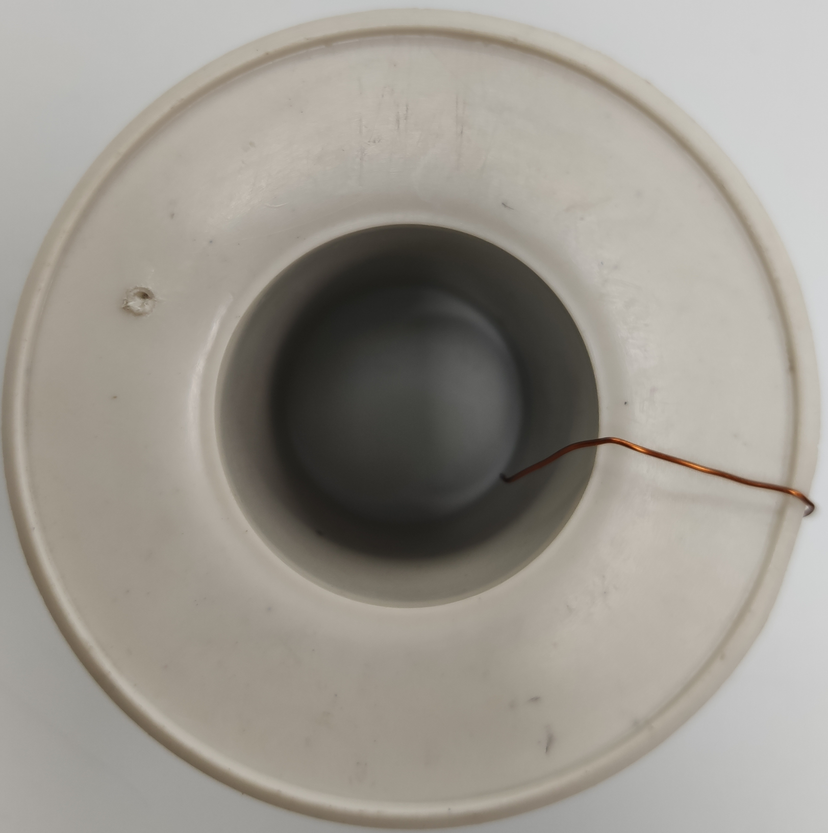 Philflex white plastic spool with copper magnet wire tail top view Magnet Wire AWG 43 - 200g
