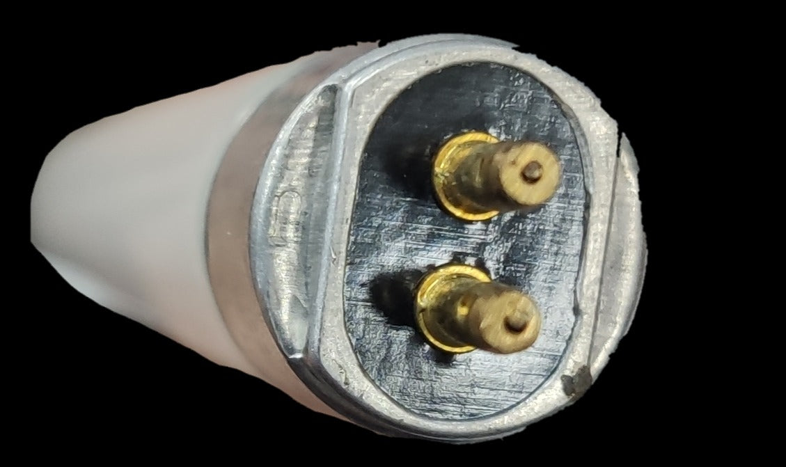 Close-up view of Firefly 8W T5 fluorescent tube end with metal pins for secure installation