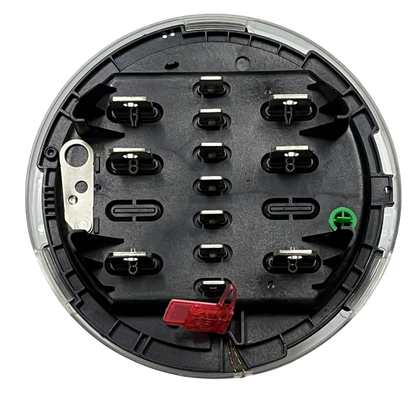 GE KV2C FM9S KWH Electric Meter component showing black circular base with metal connectors and red seal