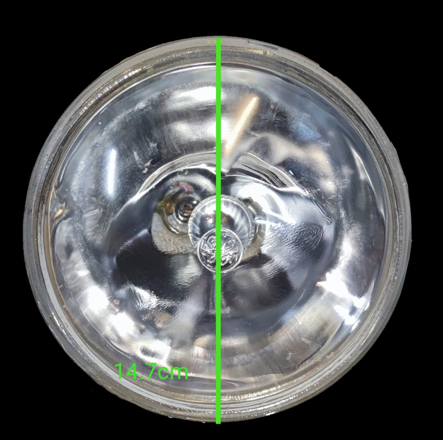 GE sealed beam 12V 30W spotlight with a clear lens and circular design for bright illumination