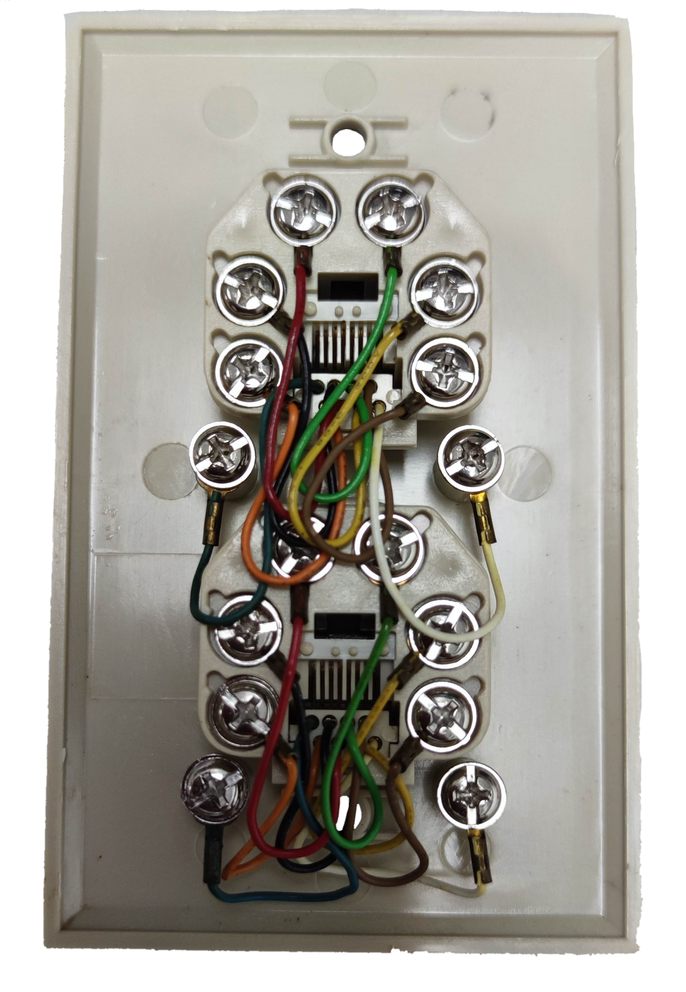 Rear view of a 2 gang LAN outlet with multiple colored wires connected to screws in an electrical circuitry part