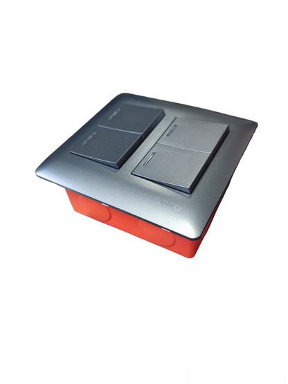 Omni 4 gang illuminated wall switch with a sleek metallic faceplate and four black rocker switches