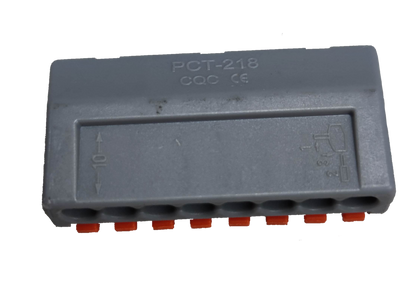 Grey plastic 8 way wire connector for electrical circuitry with secure slots and orange wire locks