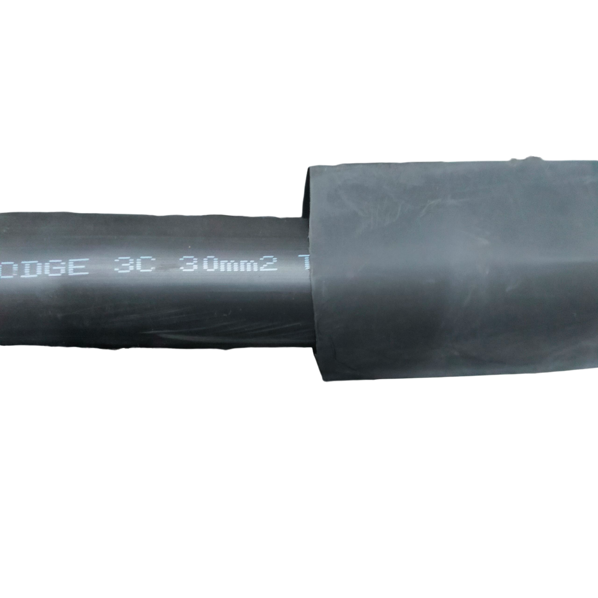 Black Heat Shrinkable Tube Black cable management tube partially covering a wire against a black background