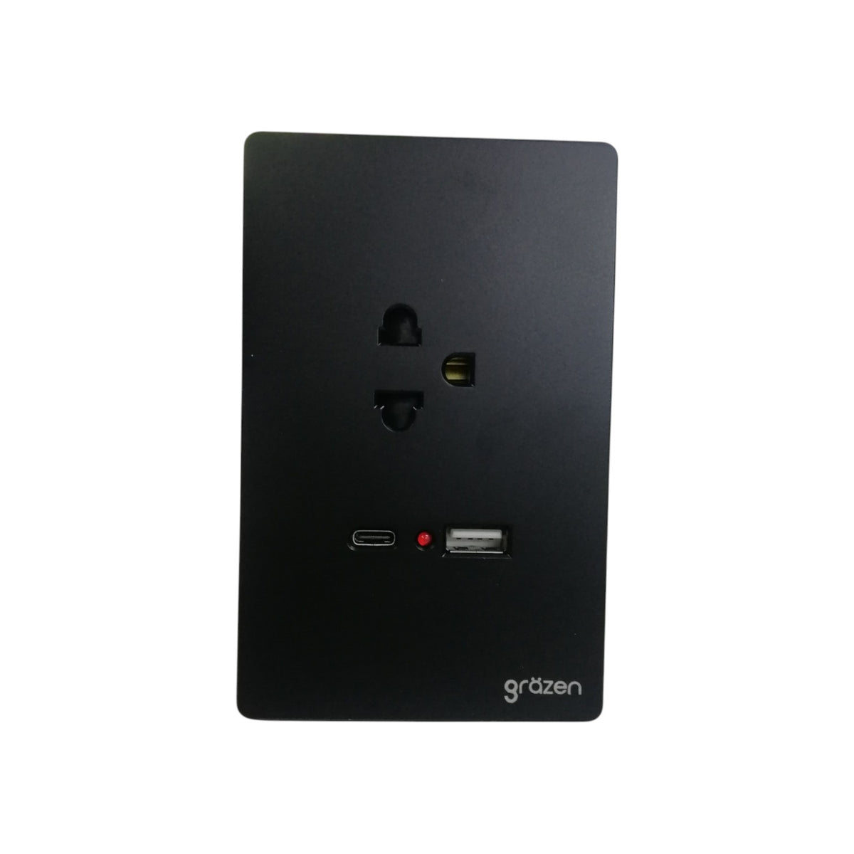 A black wall outlet cover plate with built-in USB-C and USB-A ports, featuring the 'grézen' brand logo in the bottom right corner, set against a plain white background.