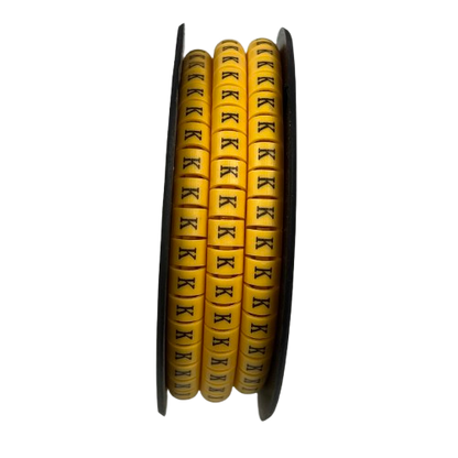 Grippes Cable Marker K - Yellow spool showing multiple K letter markers for cable identification