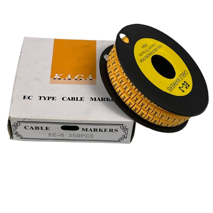 Grippes Cable Marker X - Yellow spool of numbered adhesive cable markers on black reel beside white box