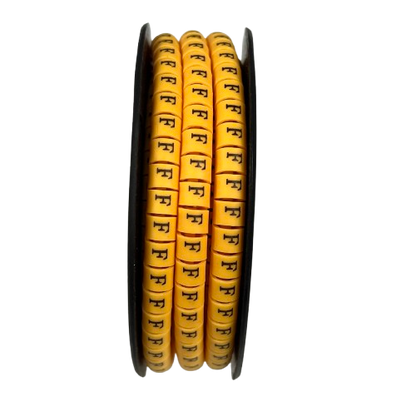 Grippes spools of Cable Marker Yellow - F cable labels on three yellow marker reels for wire identification