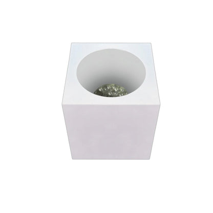 A modern square white pedestal planter with a circular recess containing small green decorative stones, shown from a top-down perspective on a white background.