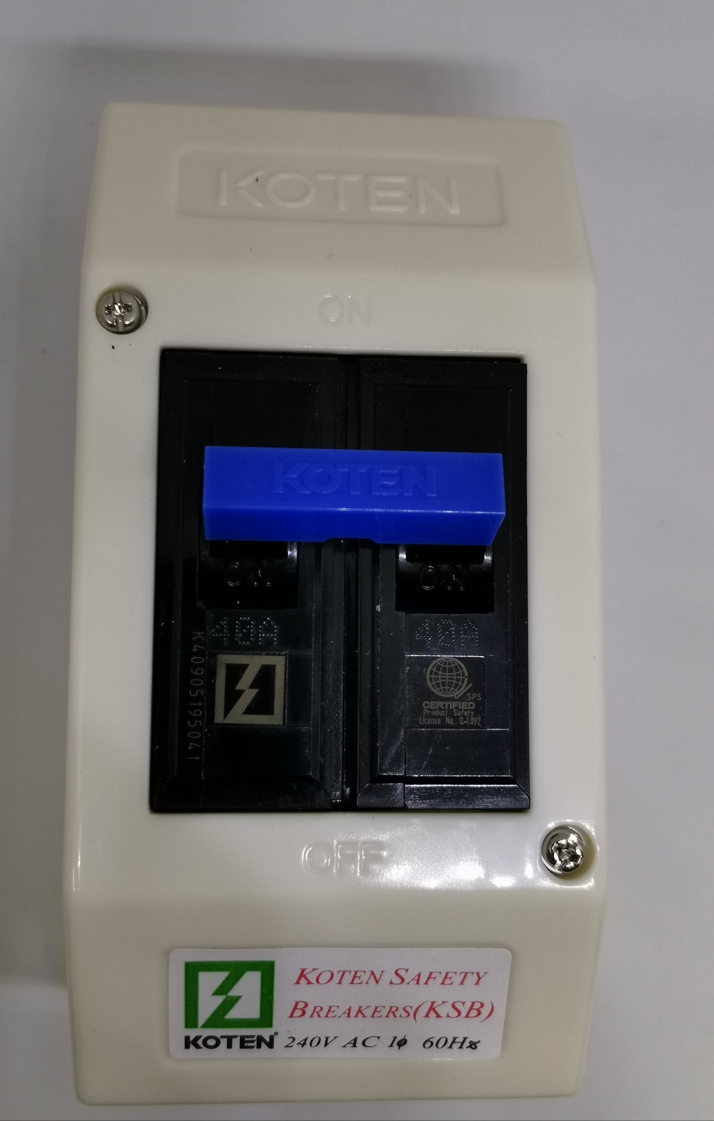 Koten single pole blue toggle on KSB 60A Circuit Breaker with PVC Enclosure. White PVC box, screws visible