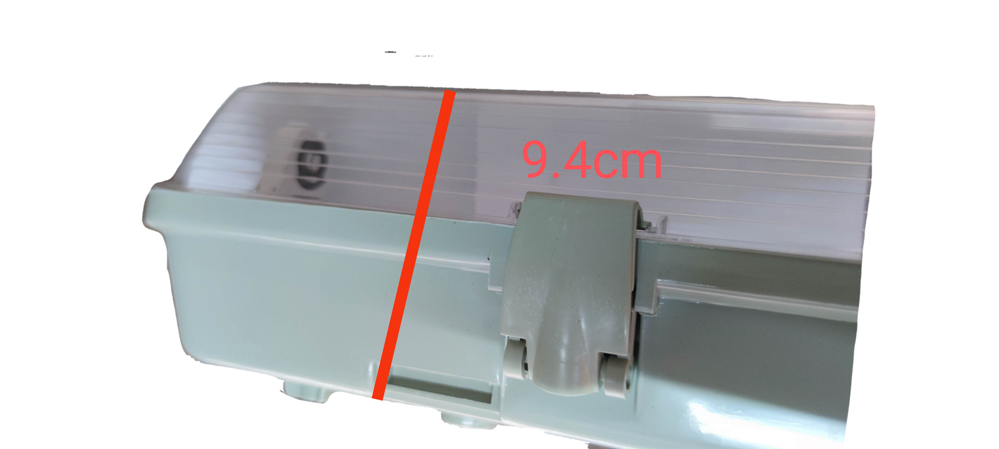 Close-up of Opple and Firefly 9W LED weatherproof fluorescent light with a measuring scale showing 9.4cm dimension