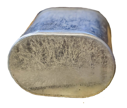 Bottom view of Mallory 30uF 370V AC capacitor showcasing its sturdy design and durability.