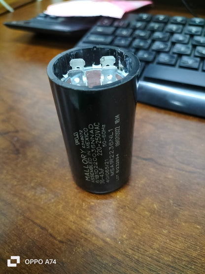 Mallory 36-43UF 220-250VAC motor capacitor on wooden desk with computer keyboard in background