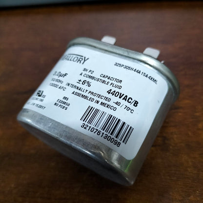 Mallory 3UF 440V oil-filled capacitor with compact design and durable metal housing.