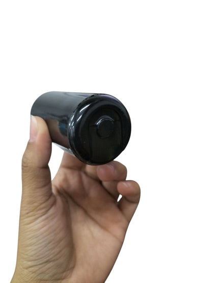 Mallory electric motor start capacitor held in hand showing cylindrical black body for electrical circuitry