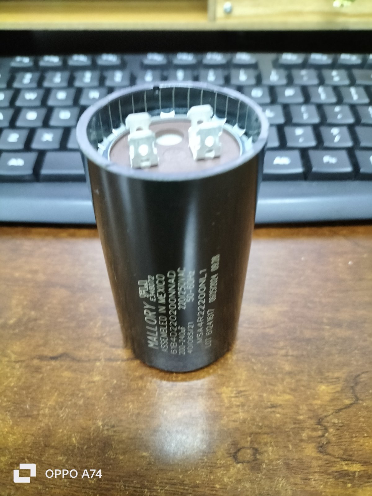 Mallory motor capacitor black cylindrical electrical component with metal terminals