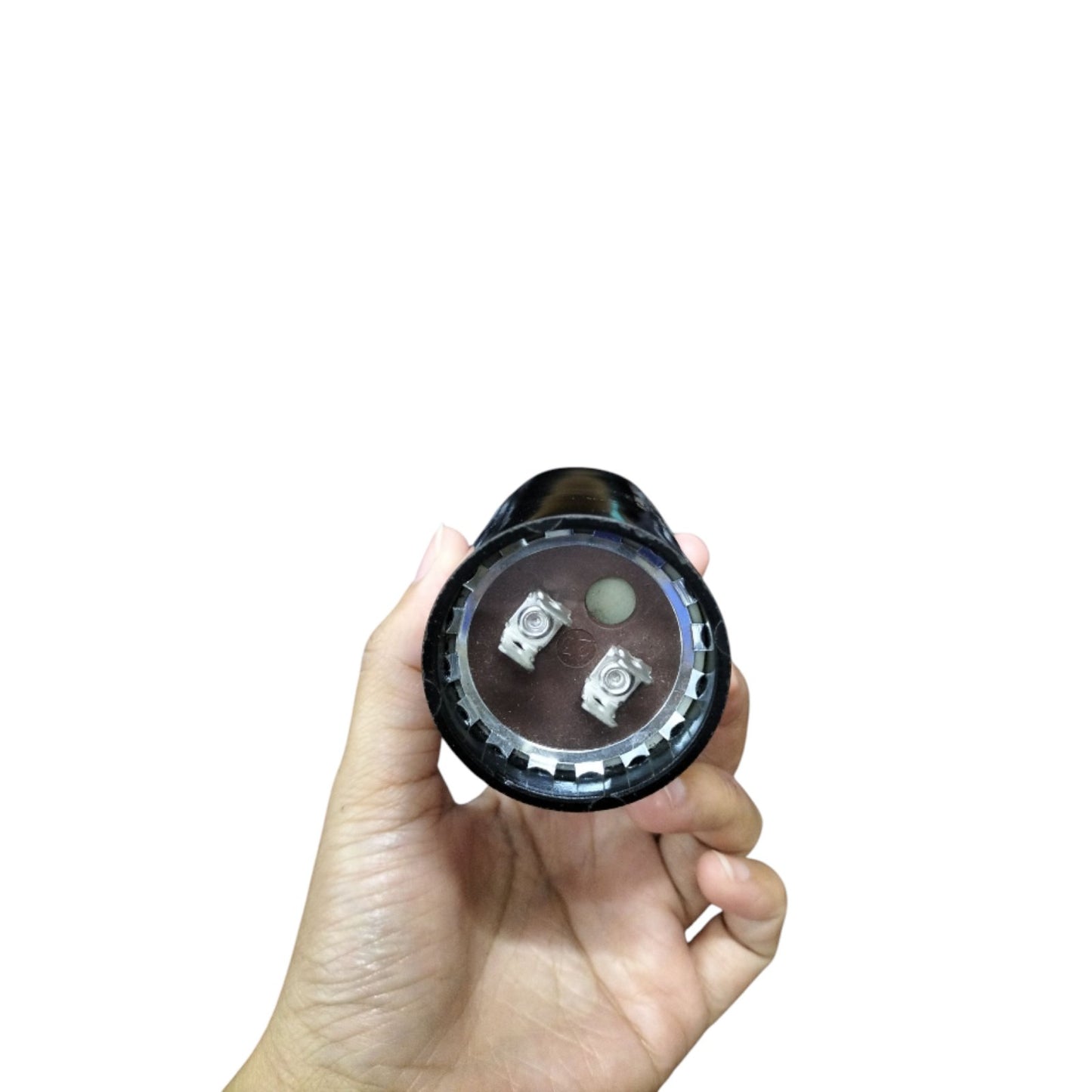 Mallory motor starting capacitor 233-280MFD held in hand for easy installation in electrical applications