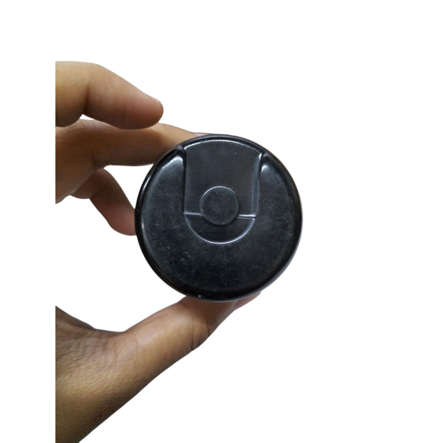 Mallory Starting capacitor 141-169uF 220V held in hand, featuring a round black design