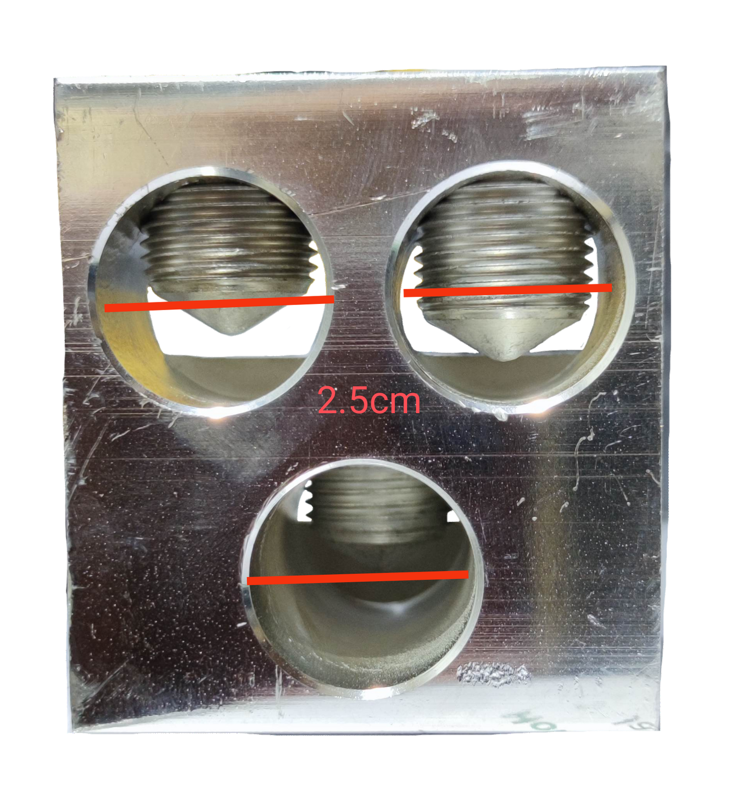 Close-up of McGILL Mechanical Lugs 3 x 600MCM with three circular metal connectors for electrical wiring