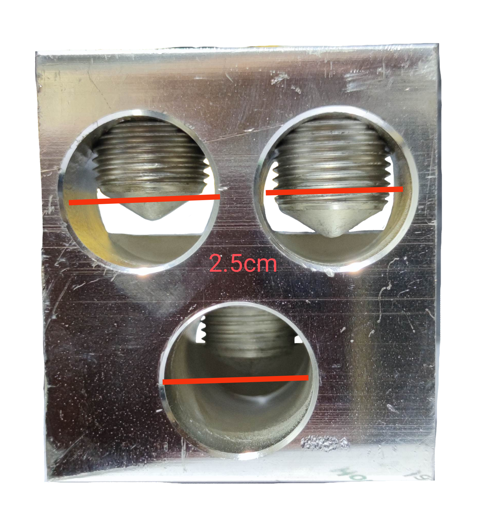 Close-up of McGILL Mechanical Lugs 3 x 600MCM with three circular metal connectors for electrical wiring