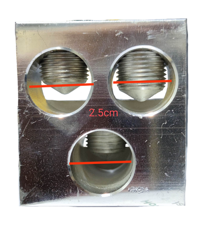 Close-up of McGILL Mechanical Lugs 3 x 600MCM with three circular metal connectors for electrical wiring