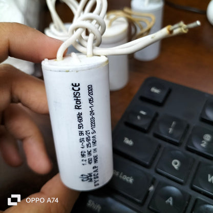 Syscap Motor Running Capacitor 1.2MFD 450v in a white cylindrical casing for electrical applications