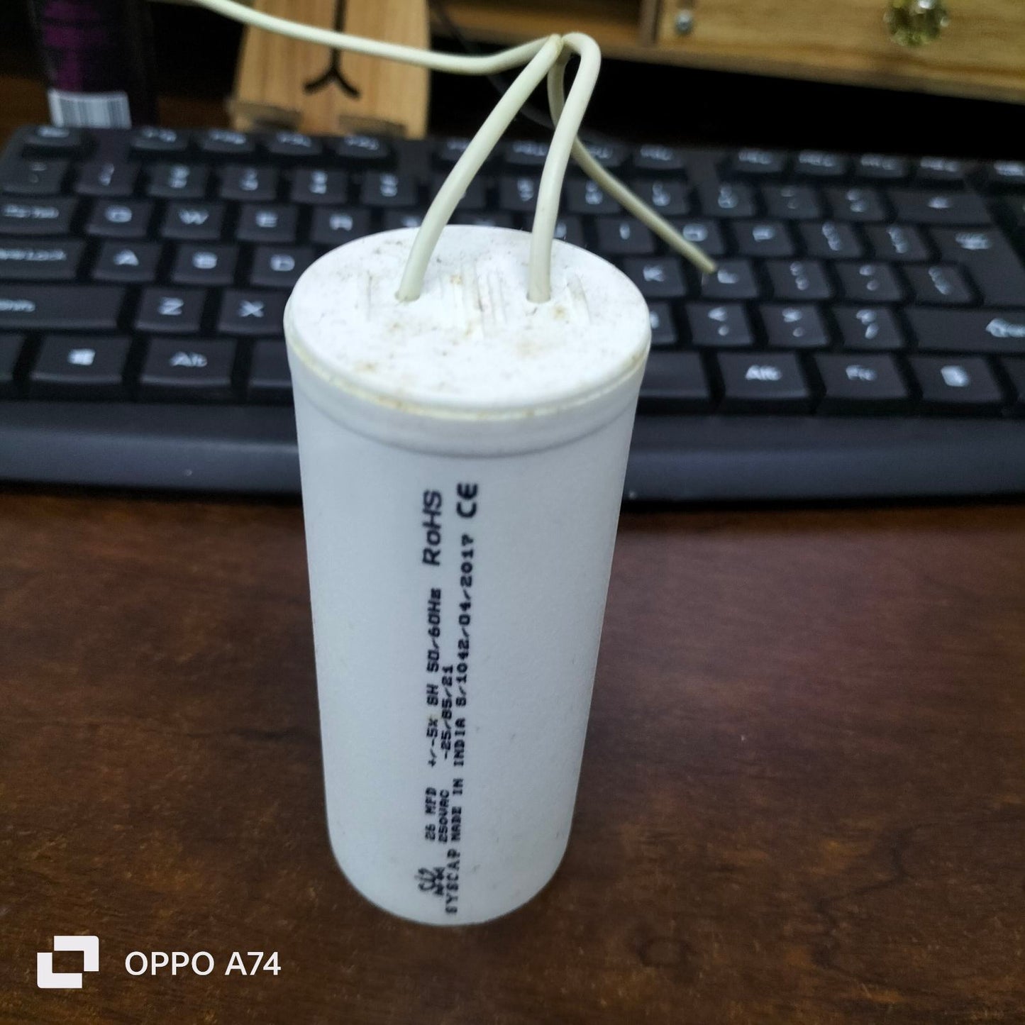 Syscap motor running capacitor white cylindrical electrical part with wires