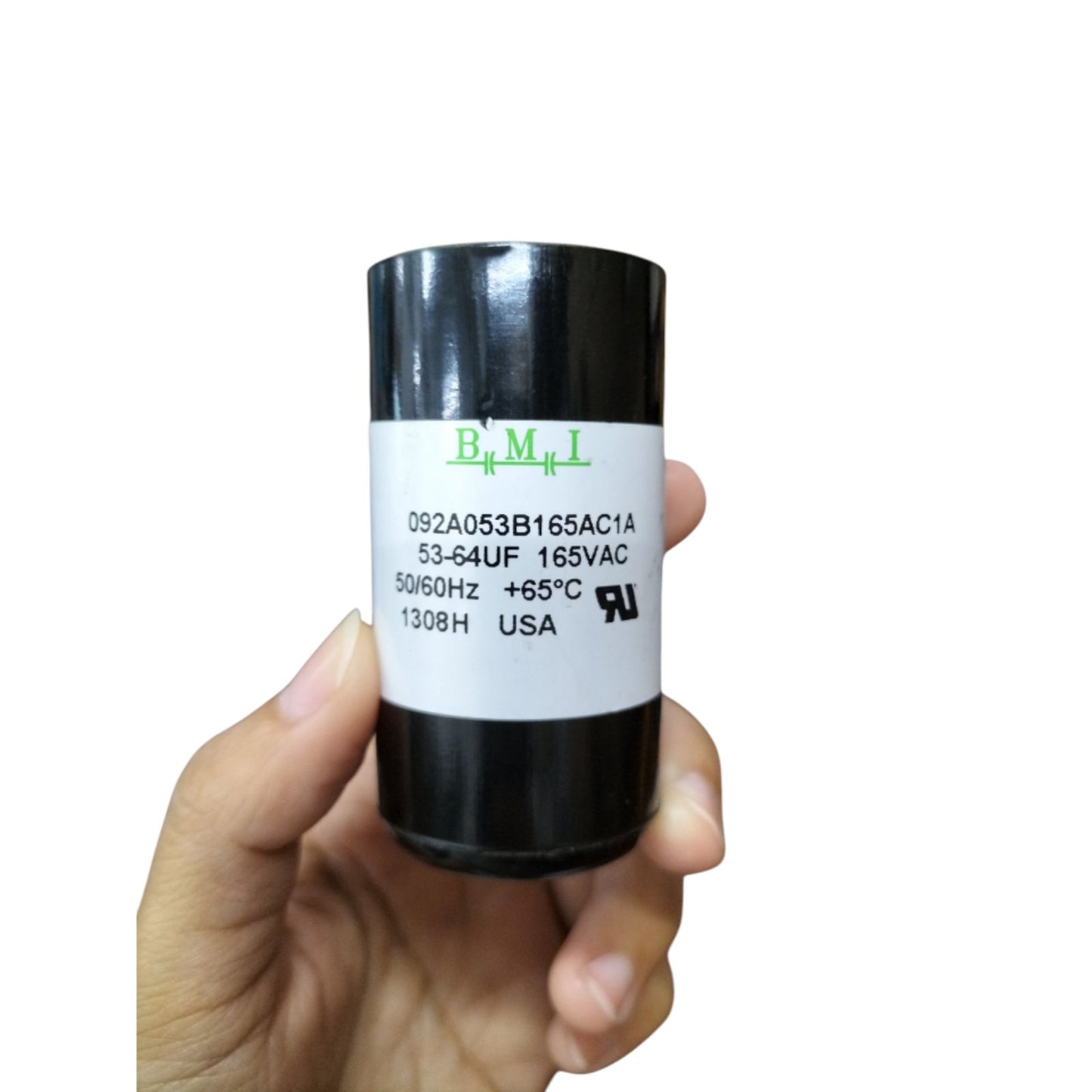 BMI motor start capacitor 53-64UF 165V in hand, designed for efficient electrical performance