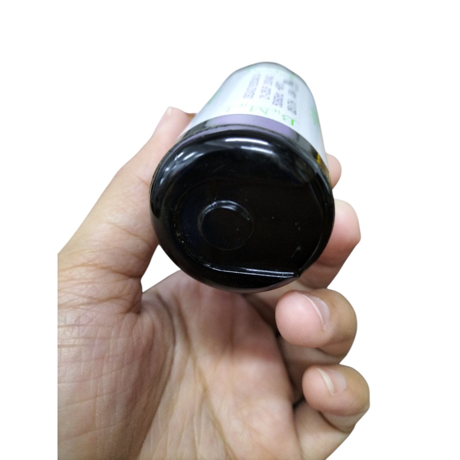 Hand holding a BMI Motor Starting Capacitor 21-25uf 250v showcasing the bottom view of the component