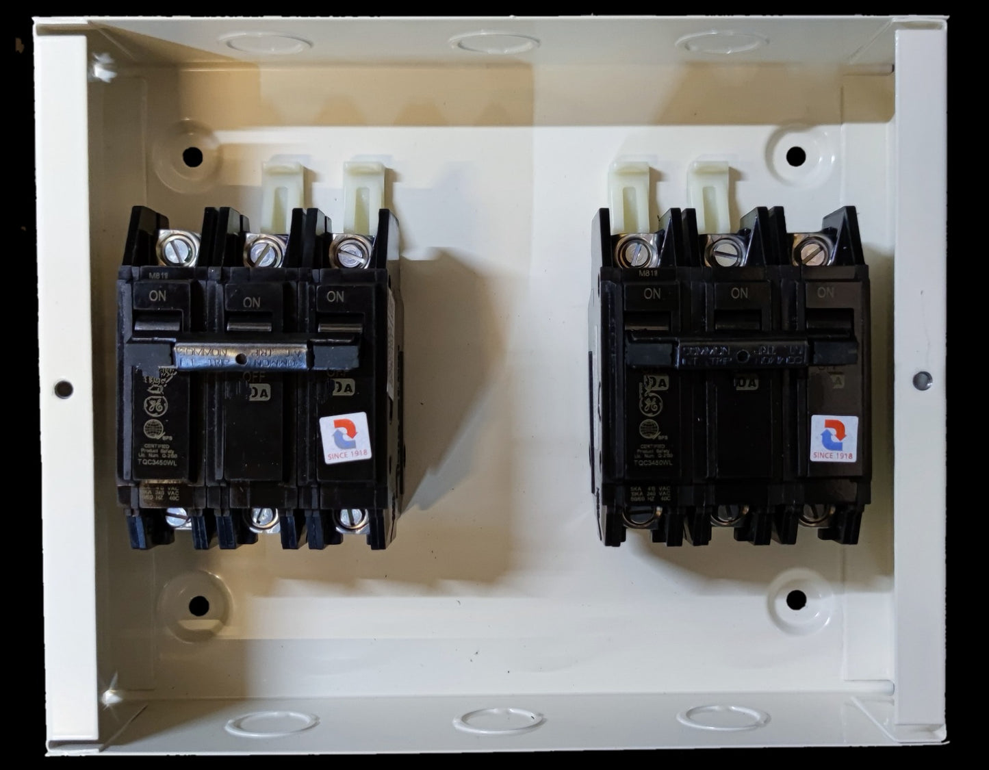 Koten and GE MTS 70A 3 Pole Three Phase electrical circuit breaker panel with two black switches