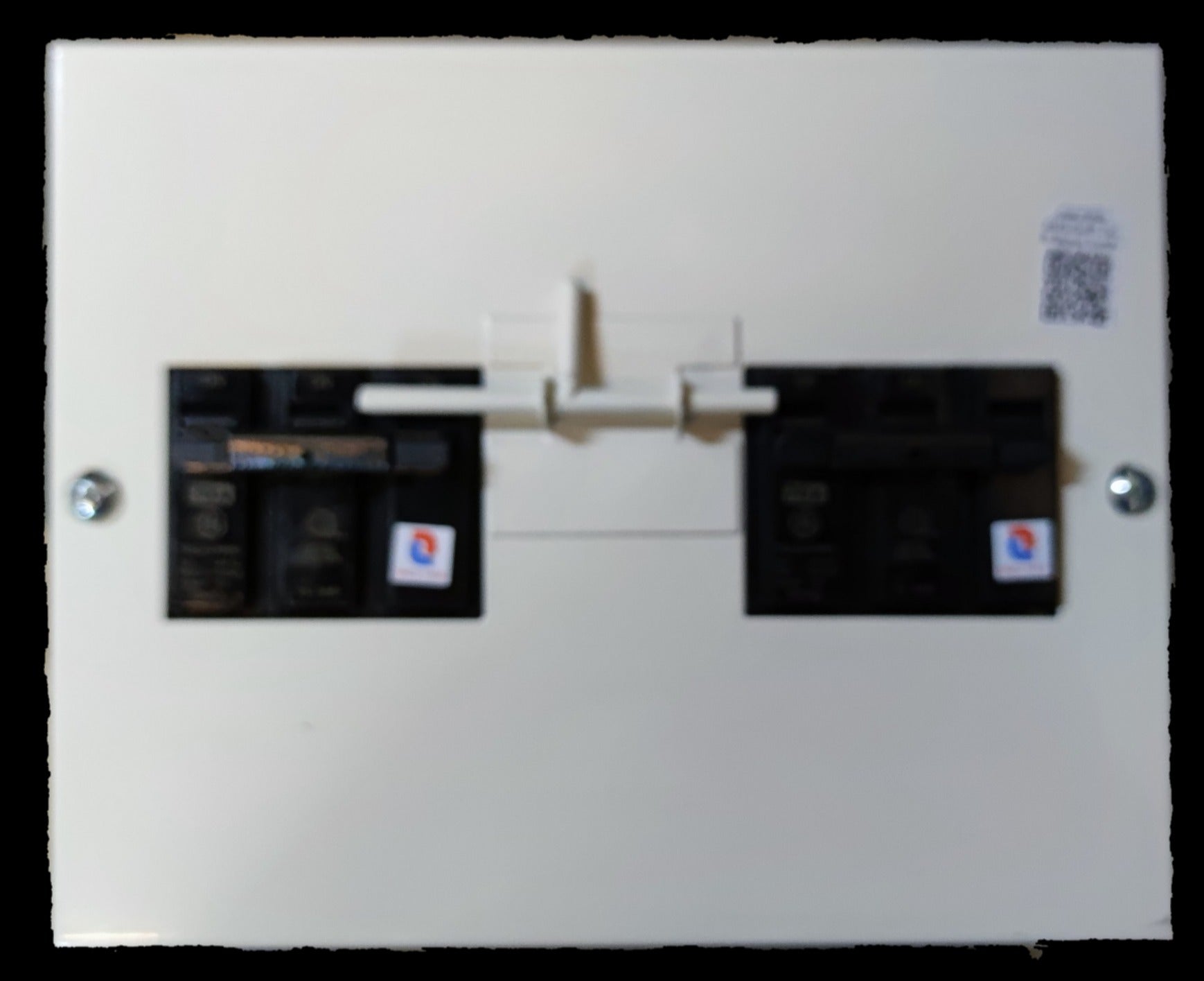 Koten and GE MTS 70A 3 Pole Three Phase electrical circuit breaker with white base and black switches