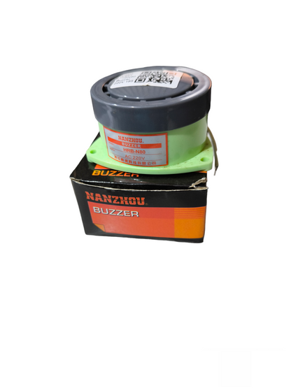 220V panel buzzer door chime device with black and green casing on black and orange box