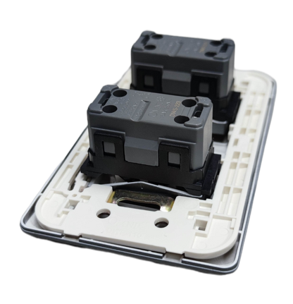 Omni 2 gang 3 way switch showing back side with wiring and mounting components
