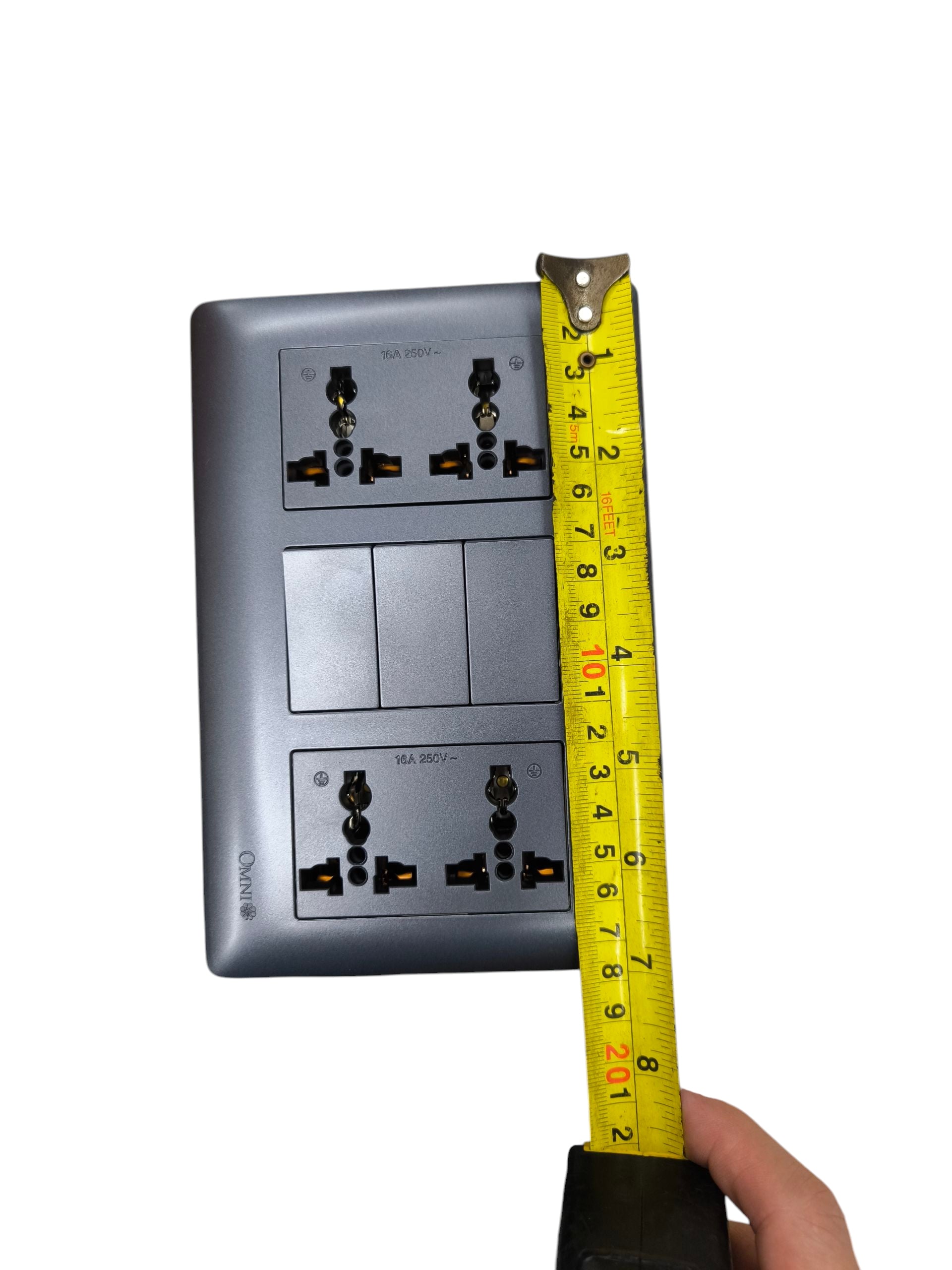 Omni 3 gang switch with 4 gang universal outlet shown with measuring tape for size reference