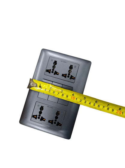 Omni 3 gang switch with 4 gang universal outlet shown with a measuring tape for size reference