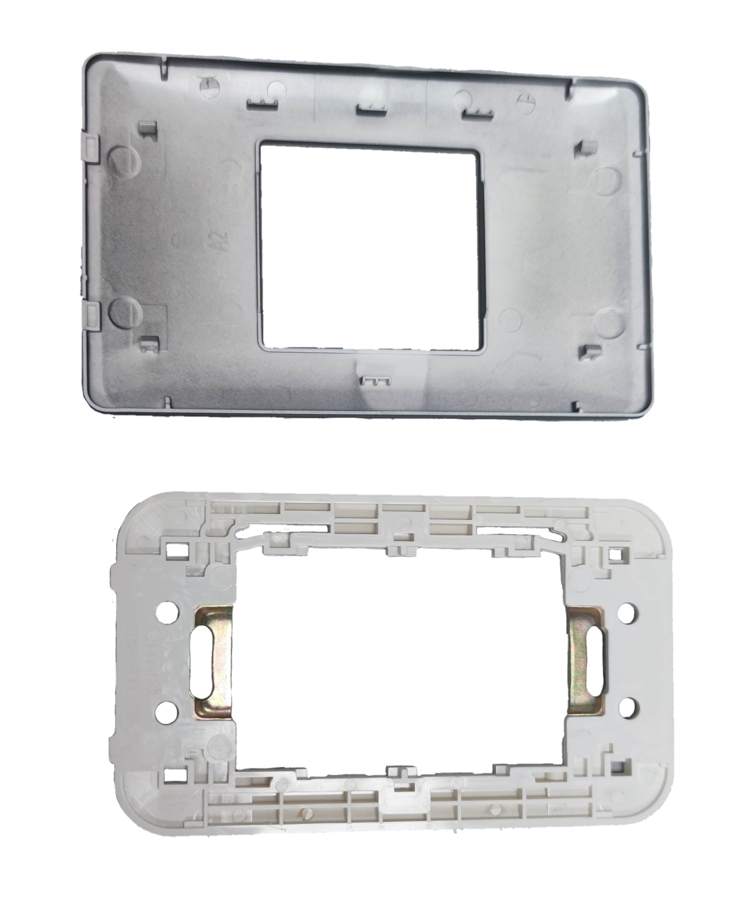 Omni Center Device Plate Graphite showing front and back plastic mounting frames for power points and switches