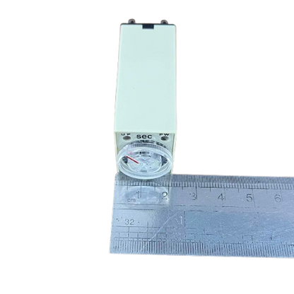 OMRON relay timer with front dial and clear knob on ruler showing size Timer Relay 10 seconds 8 pins 110V