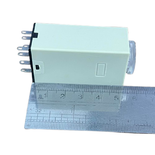 OMRON Timer Relay 30 seconds 8 pins 110V compact beige rectangular housing with adjustment dial and visible pins next to ruler