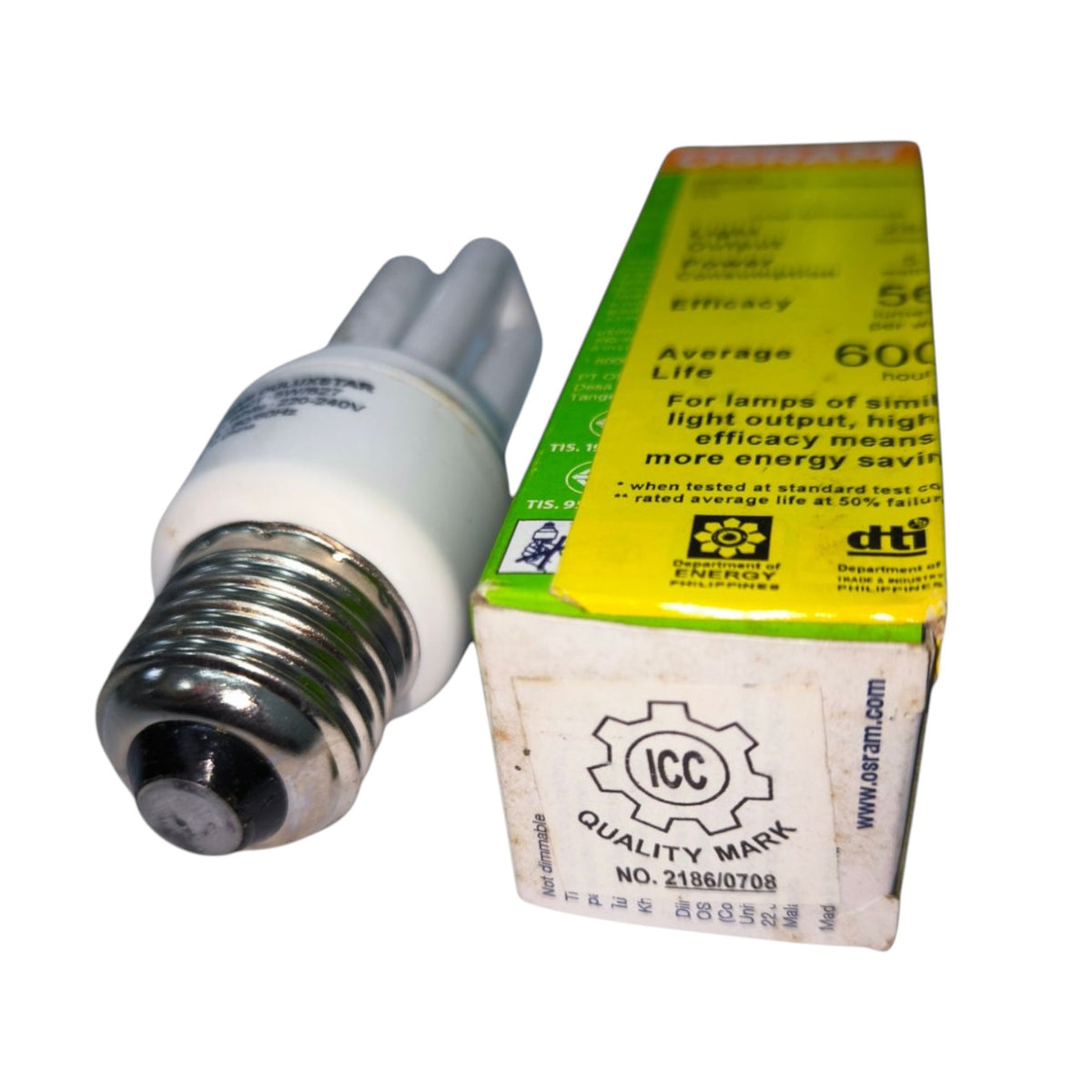 A compact fluorescent light bulb with a silver screw base and white plastic tube, shown next to its green and yellow retail box on a white background.