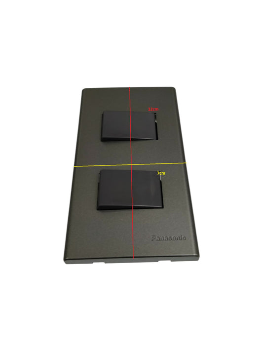 Panasonic 2 gang 4 way switch with black rocker buttons on a gray plate for power control